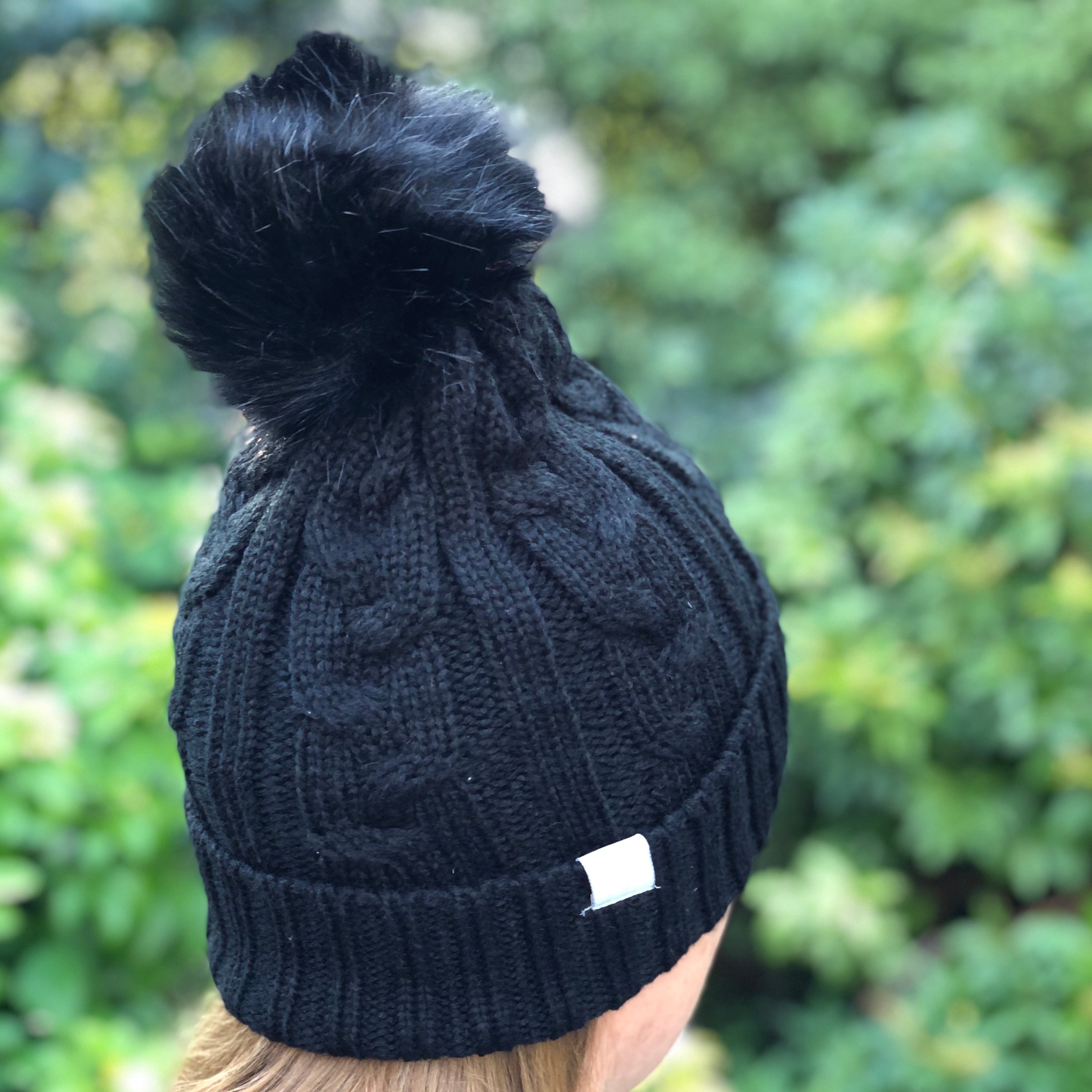 Black hat with clearance bobble